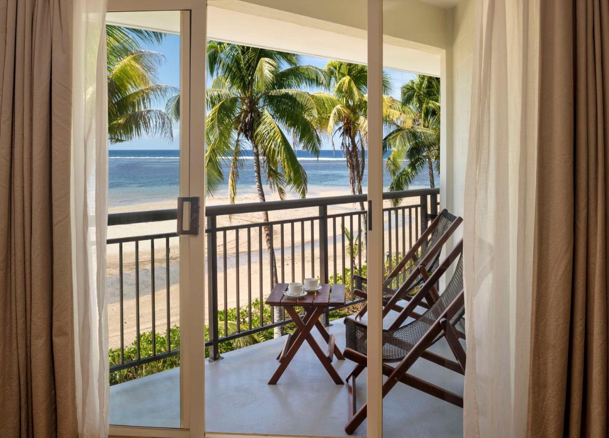Outrigger Fiji Beach Resort Korotogo Dış mekan fotoğraf A view of the beach from a room at the resort